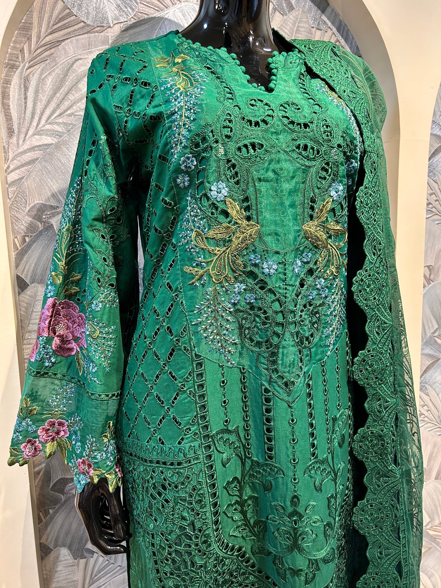 Green cotton suit with intricate thread embroidery and cutwork, floral motifs and matching dupatta