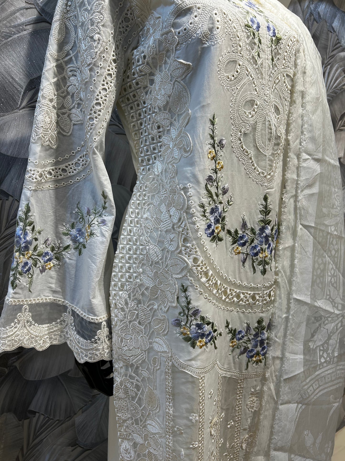 Antique white cotton embroidered suit with floral threadwork in blue and yellow, cutwork detailing, and matching dupatta