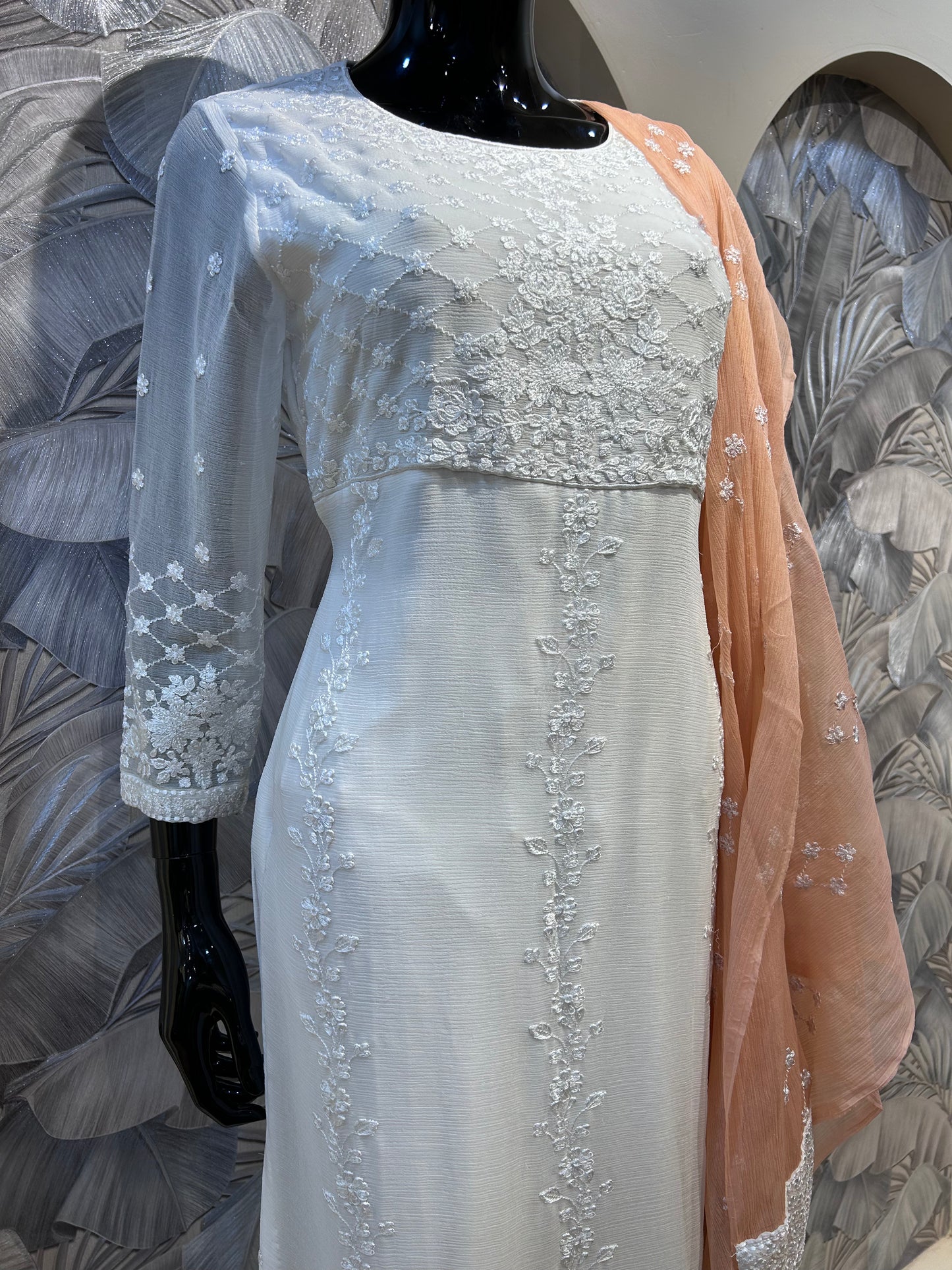 White chiffon suit with delicate floral embroidery and peach embroidered dupatta