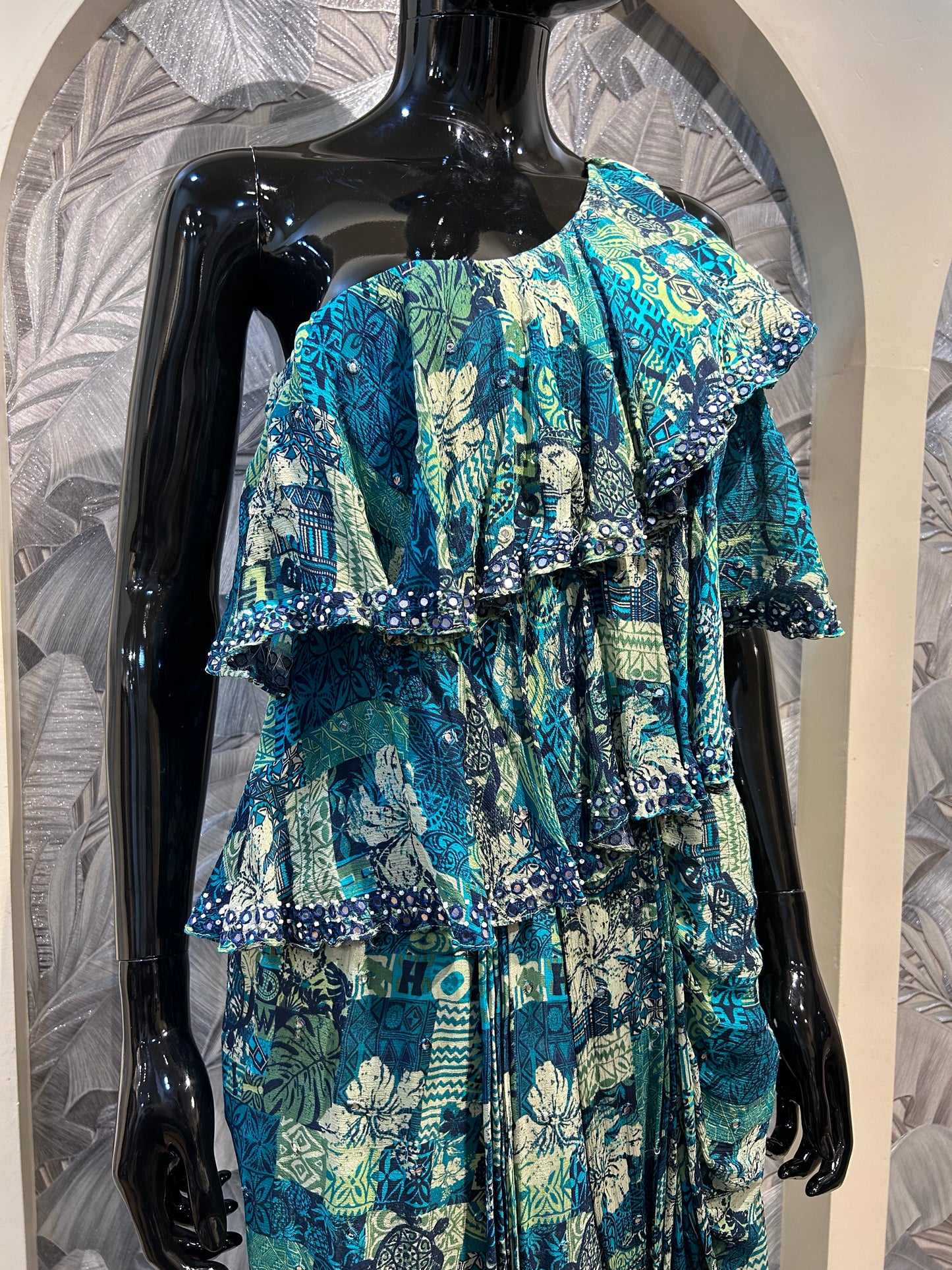 One-shoulder chiffon set with multicolored teal and blue print, layered ruffles, and draped silhouette