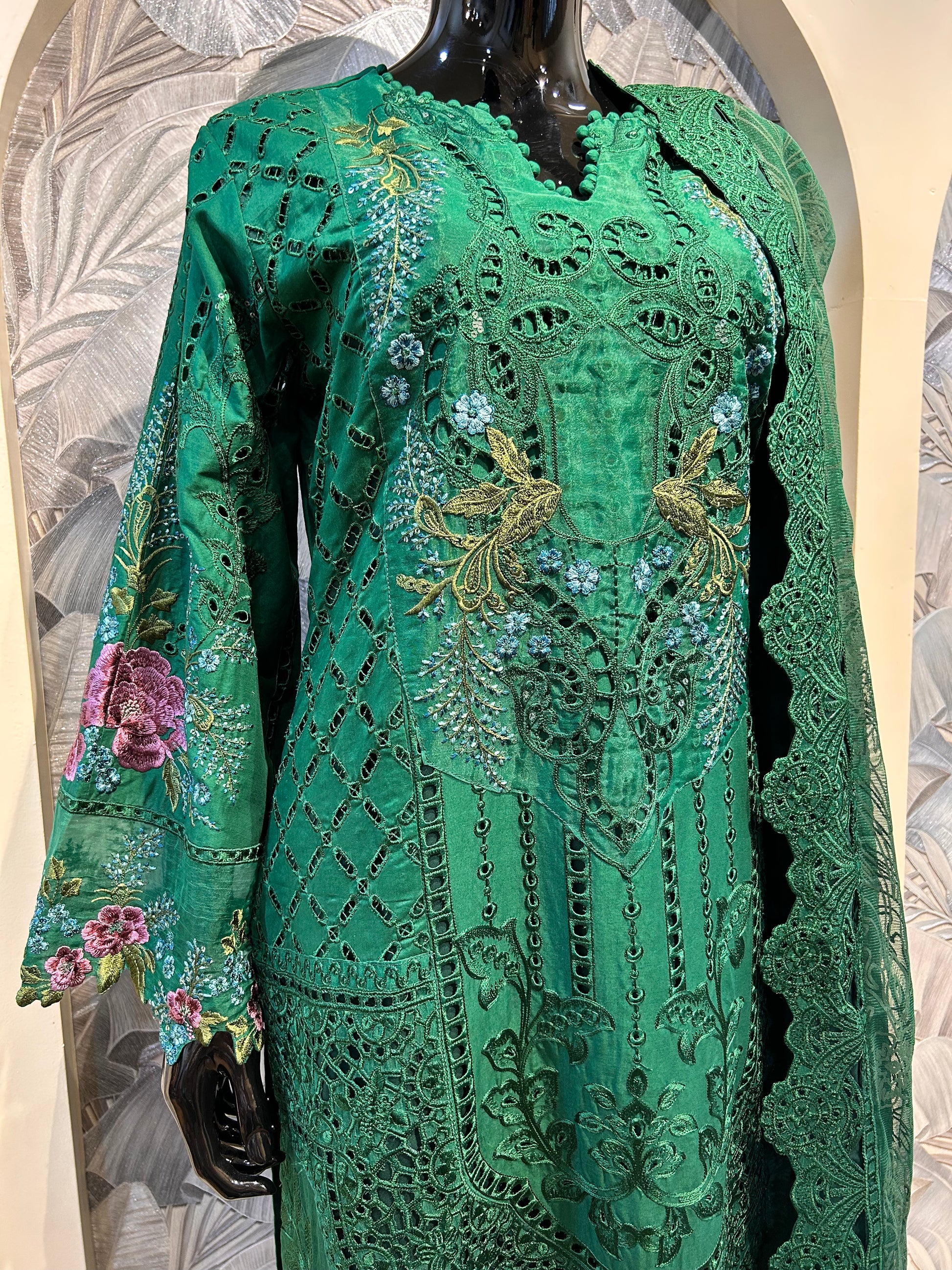 Green cotton suit with intricate thread embroidery and cutwork, floral motifs and matching dupatta