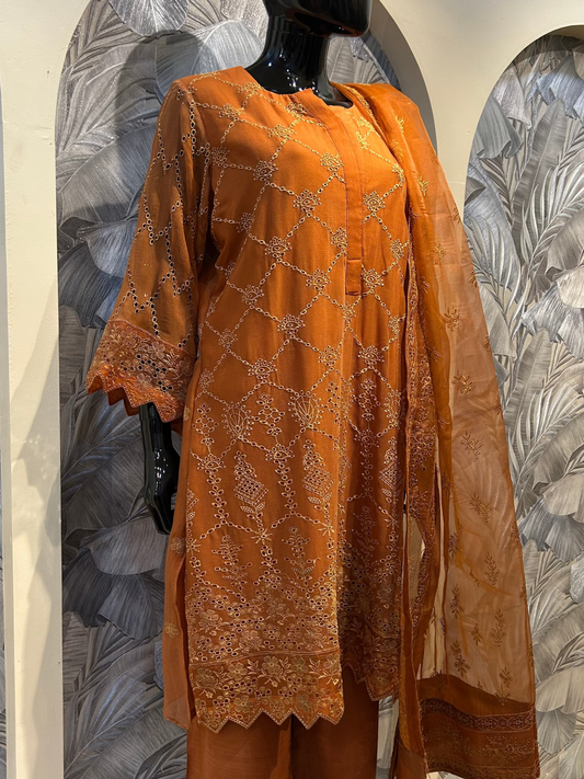 Saddle brown chiffon suit with diamond and floral embroidery, scalloped sleeve edges, and embroidered dupatta