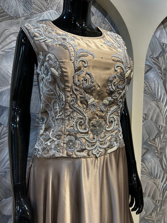 Champagne satin gown with silver embellished bodice and flared floor-length skirt
