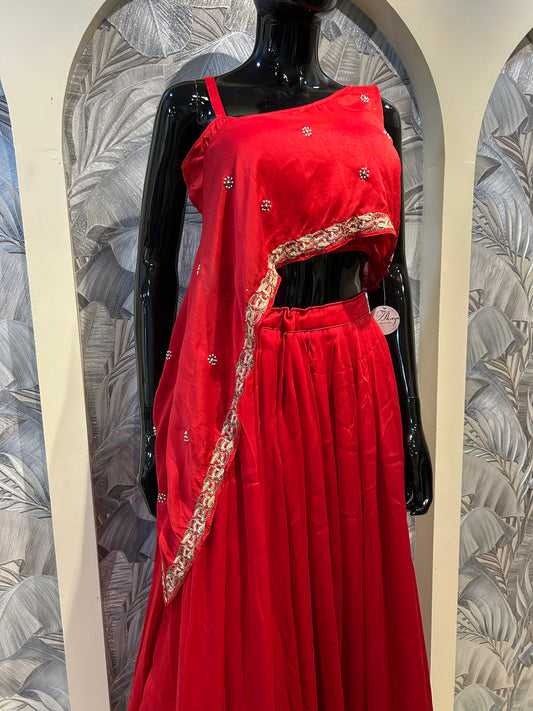 Lava red organza three-piece set with asymmetric blouse, mirror embellishments, draped overlay with golden lace, and flowy skirt